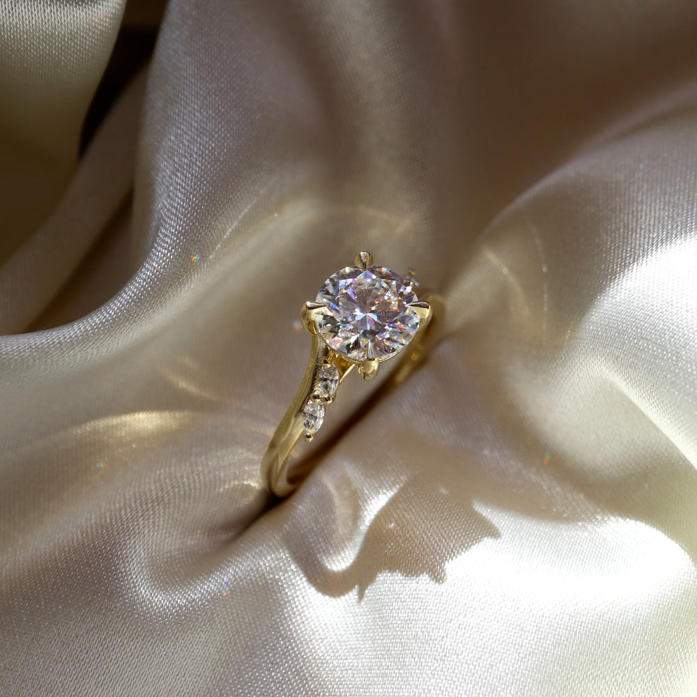 
                      
                        The Amira Ring - Round with Marquise Accents
                      
                    