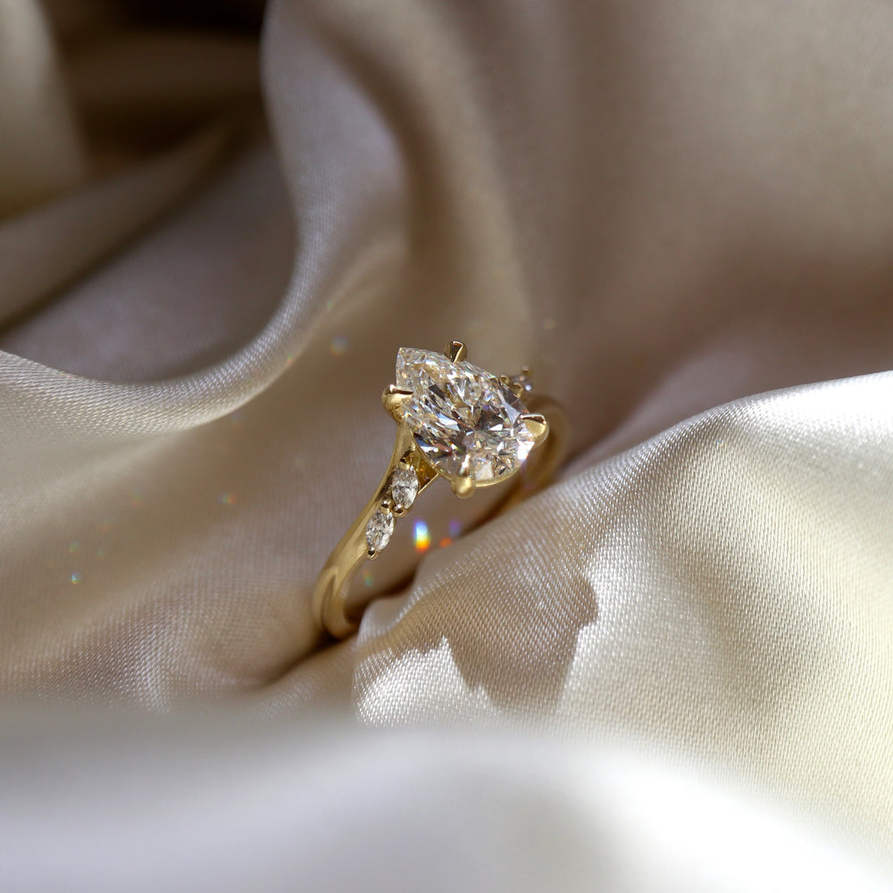 
                      
                        The Amira Ring - Pear with Marquise Accents
                      
                    