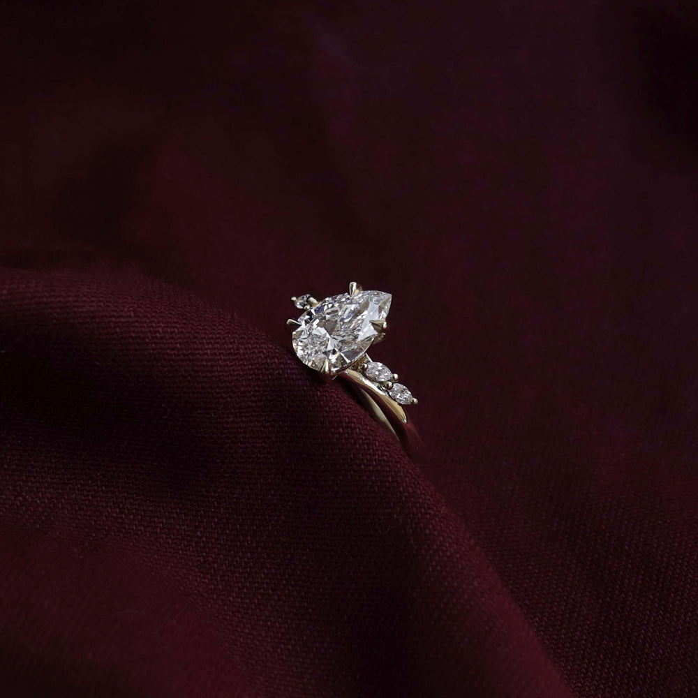 
                      
                        The Amira Ring - Pear with Marquise Accents
                      
                    