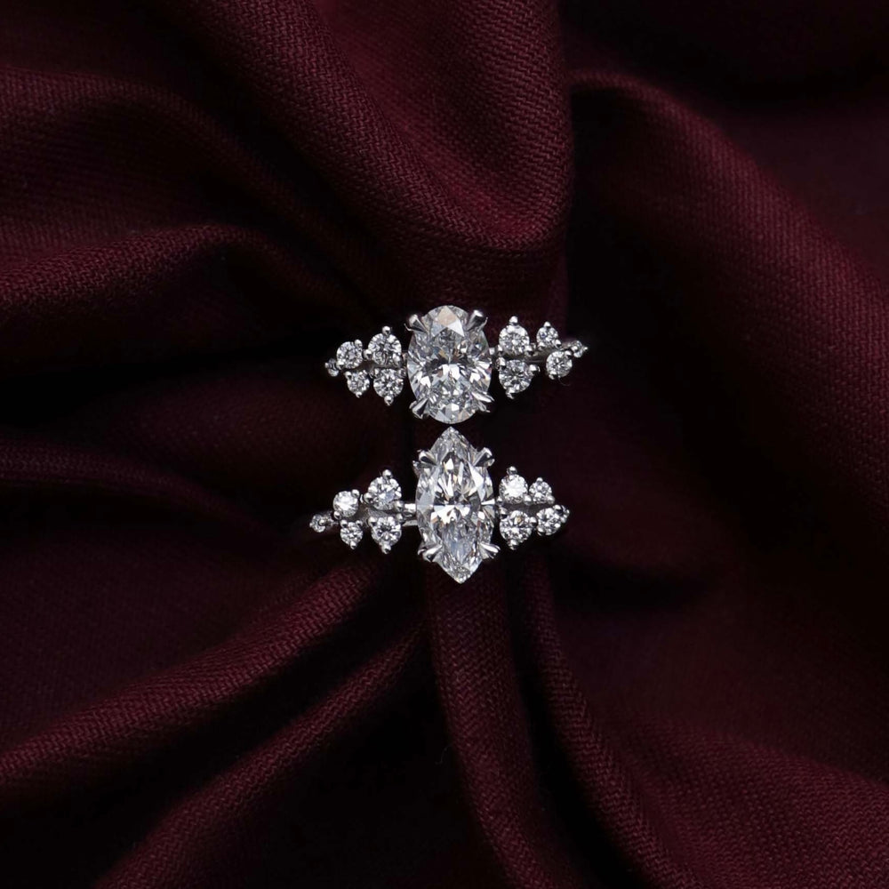 
                      
                        The Aurora Ring - Marquise with Round Brilliant Accents
                      
                    