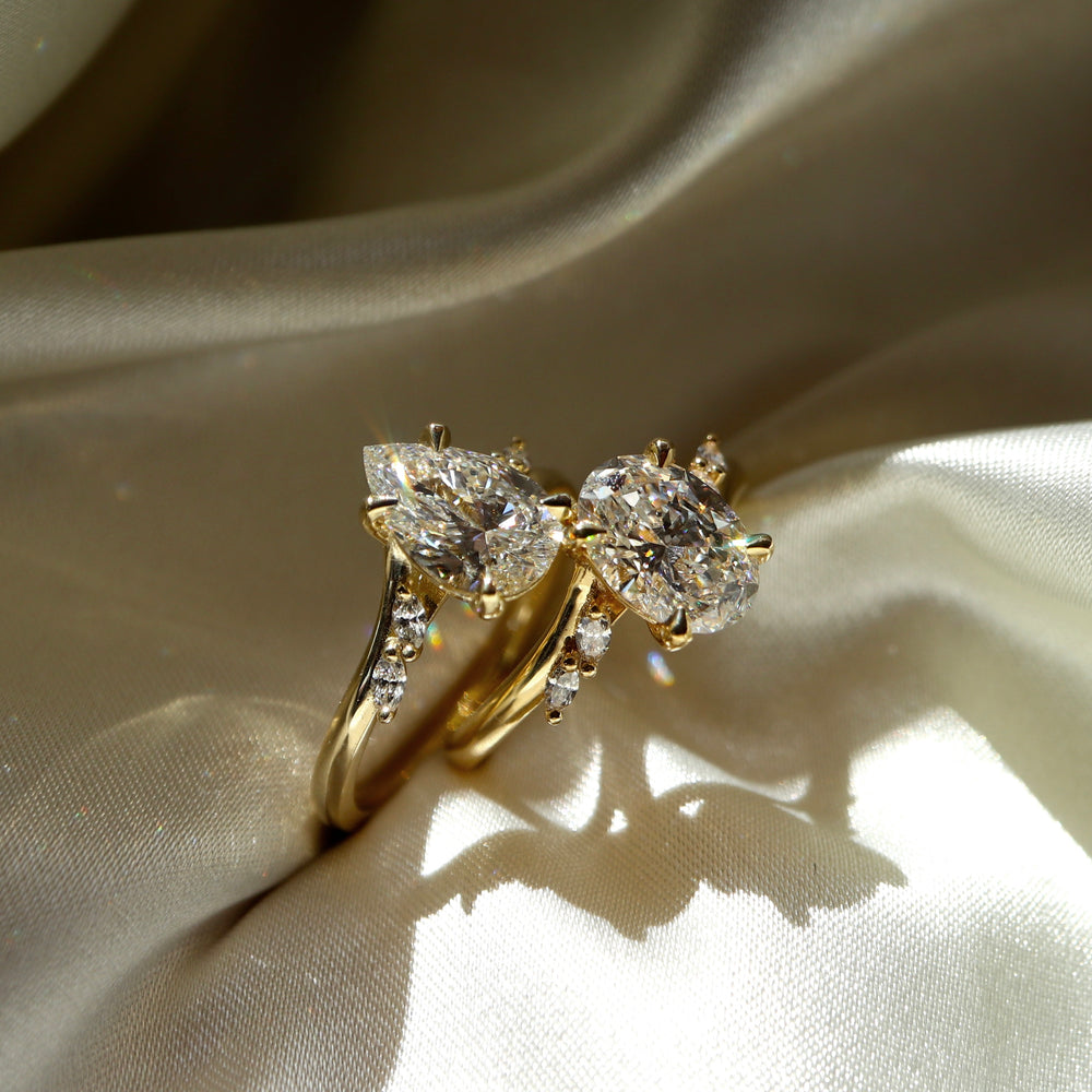 
                      
                        The Amira Ring - Pear with Marquise Accents
                      
                    