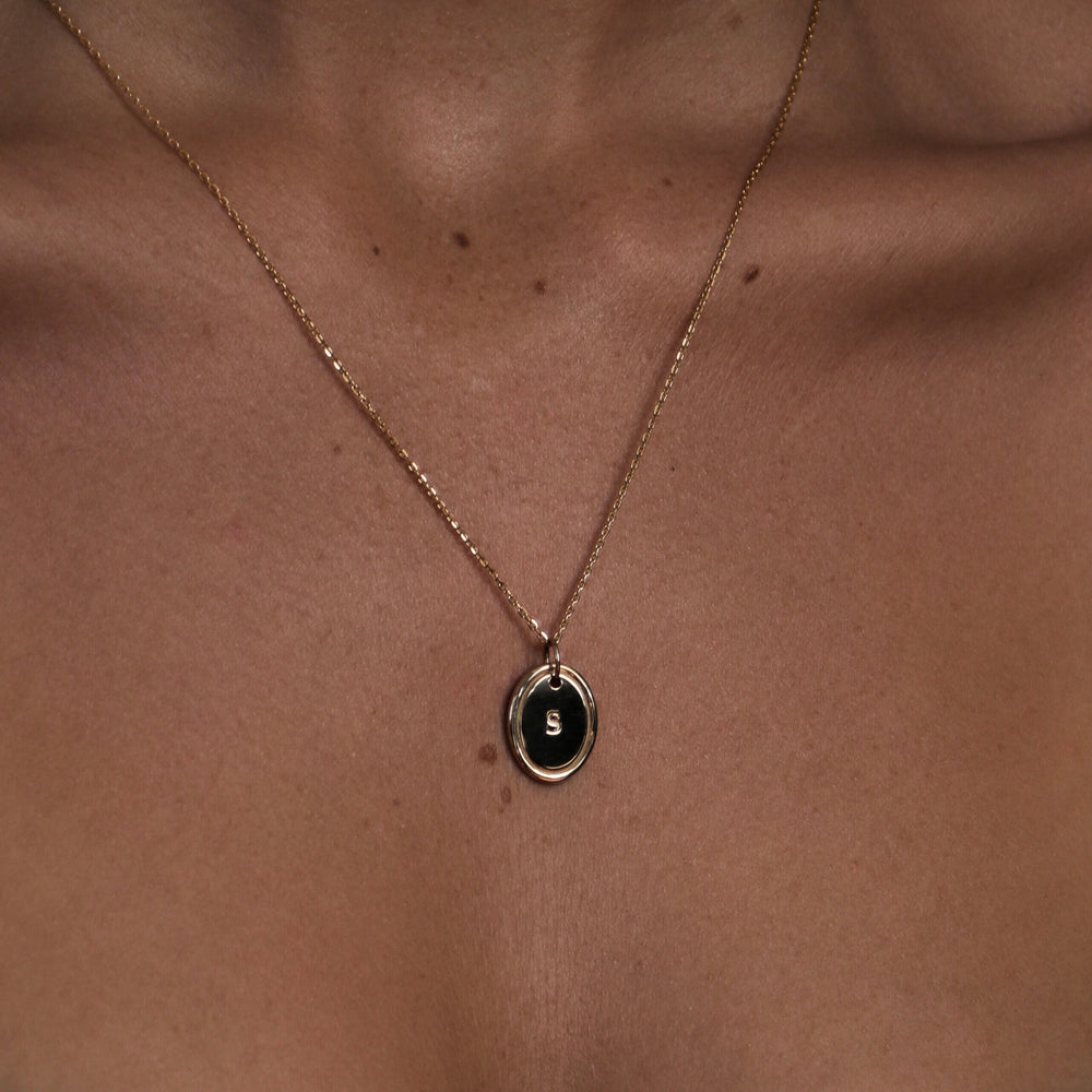 
                      
                        The Signature Oval Letter Pendant
                      
                    