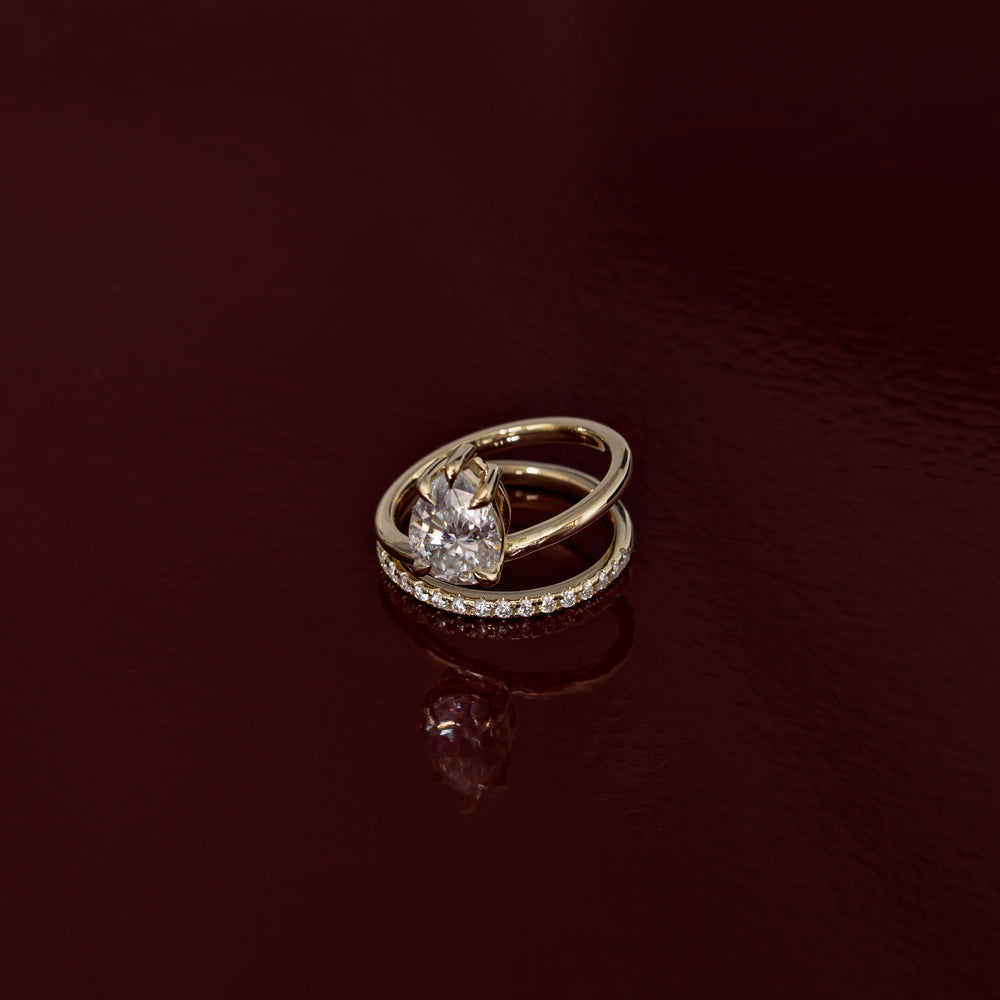 
                      
                        The Emerie Ring - Pear Double Band Solitaire
                      
                    