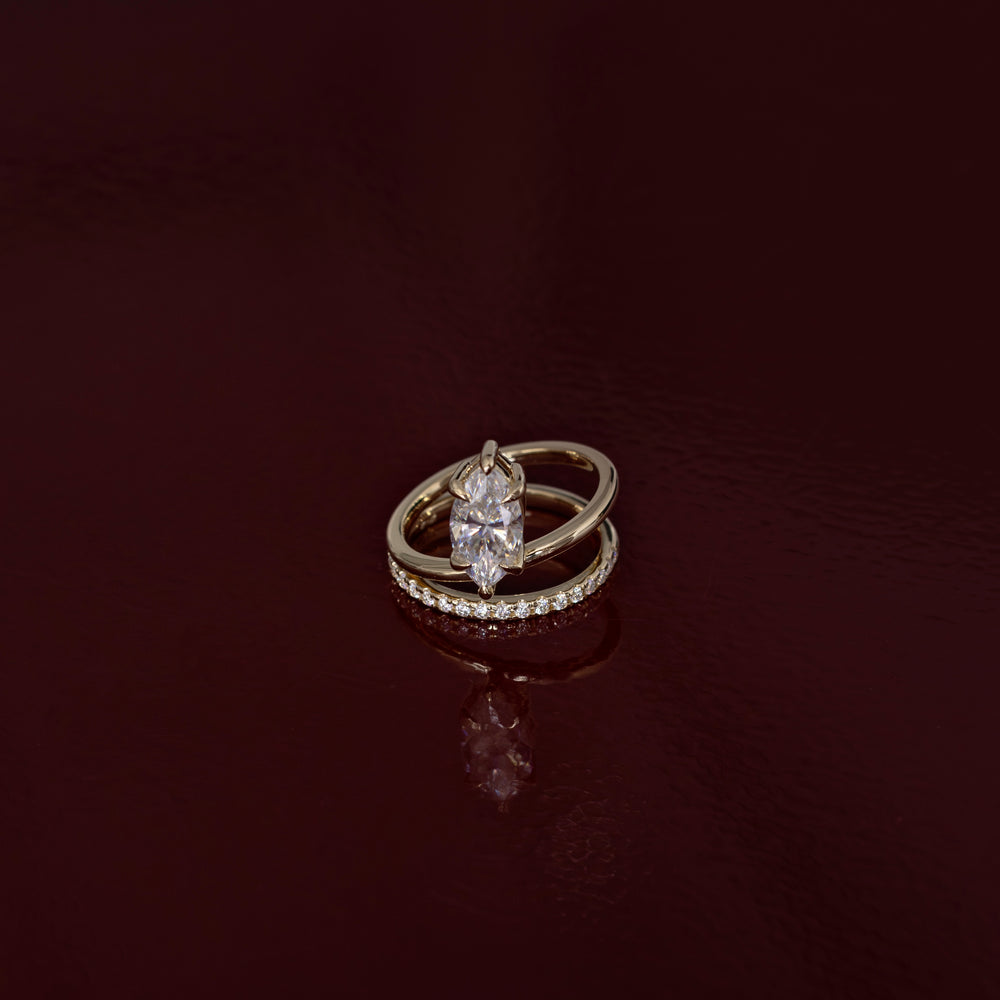 
                      
                        The Emerie Ring - Marquise Double Band Solitaire
                      
                    