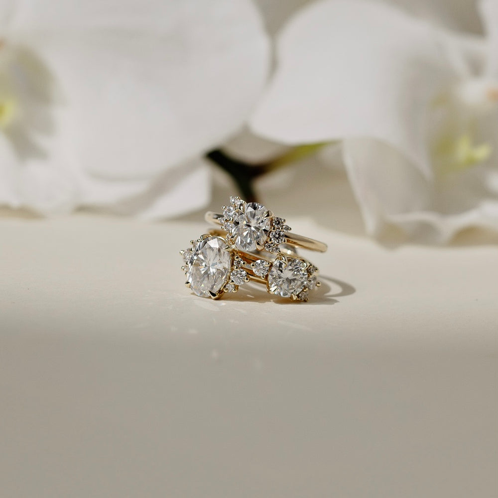 
                      
                        The Fleur Ring - Oval With Round Brilliant Accent Stones
                      
                    