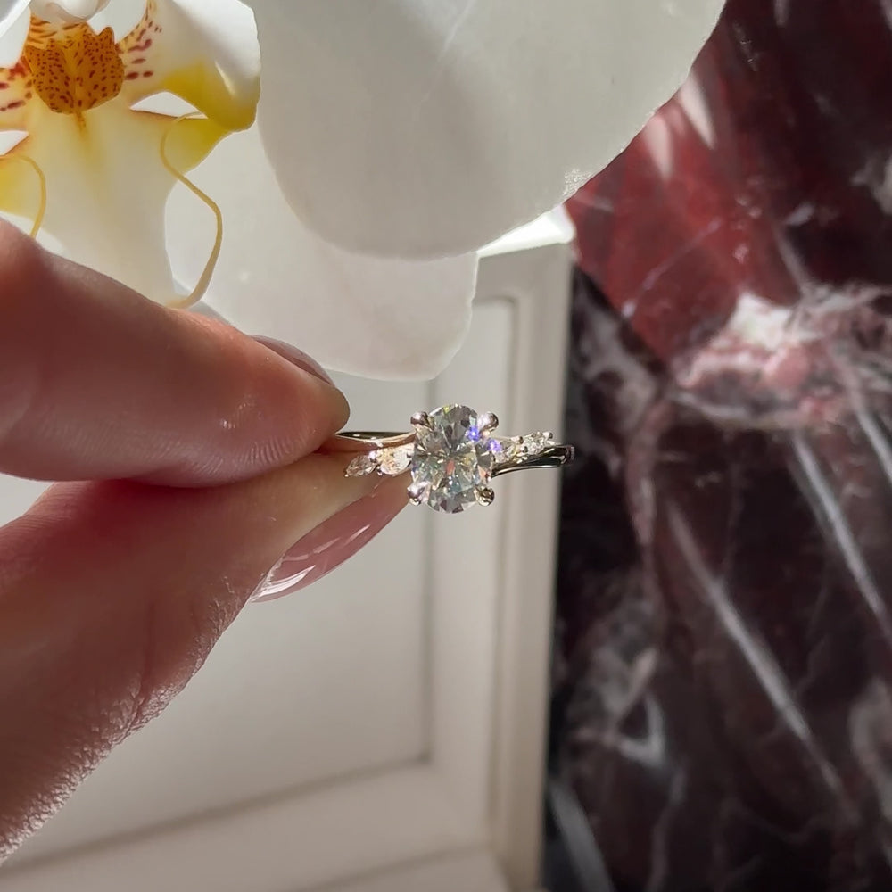 
                      
                        Load and play video in Gallery viewer, The Amira Ring - 1.5ct Moissanite Oval with Marquise Accents
                      
                    