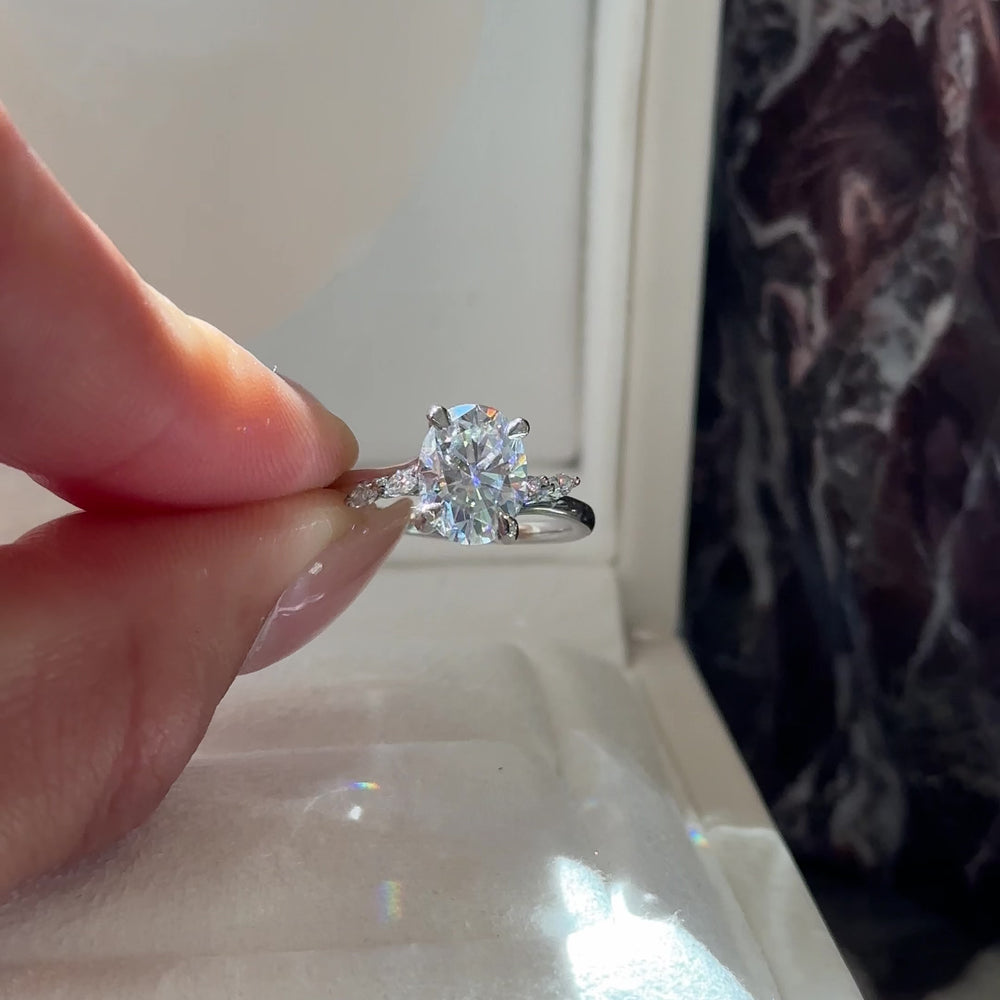 
                      
                        Load and play video in Gallery viewer, The Amira Ring - 2.1ct Moissanite Oval with Marquise Accents
                      
                    