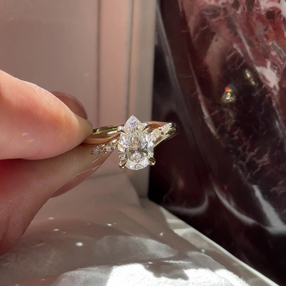 
                      
                        Load and play video in Gallery viewer, The Amira Ring - 1.54ct Lab Grown Diamond Pear with Marquise Accents
                      
                    