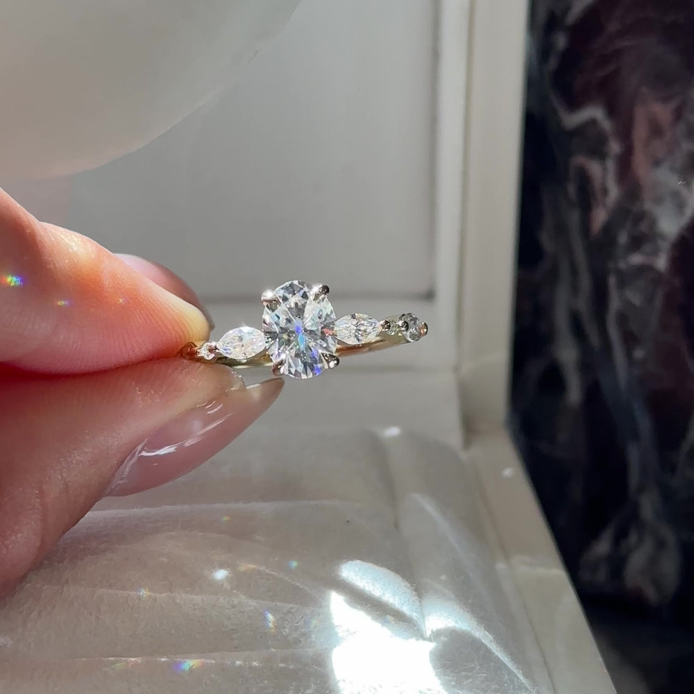 
                      
                        Load and play video in Gallery viewer, The Avery Ring - 1.5ct Moissanite Oval Solitaire with Marquise Band
                      
                    