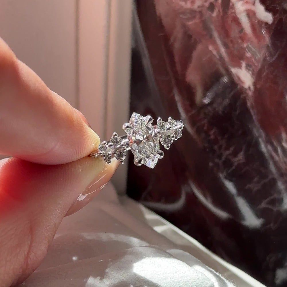 
                      
                        Load and play video in Gallery viewer, The Aurora Ring - 1.04ct Lab Grown Diamond Marquise with Round Brilliant Accents
                      
                    