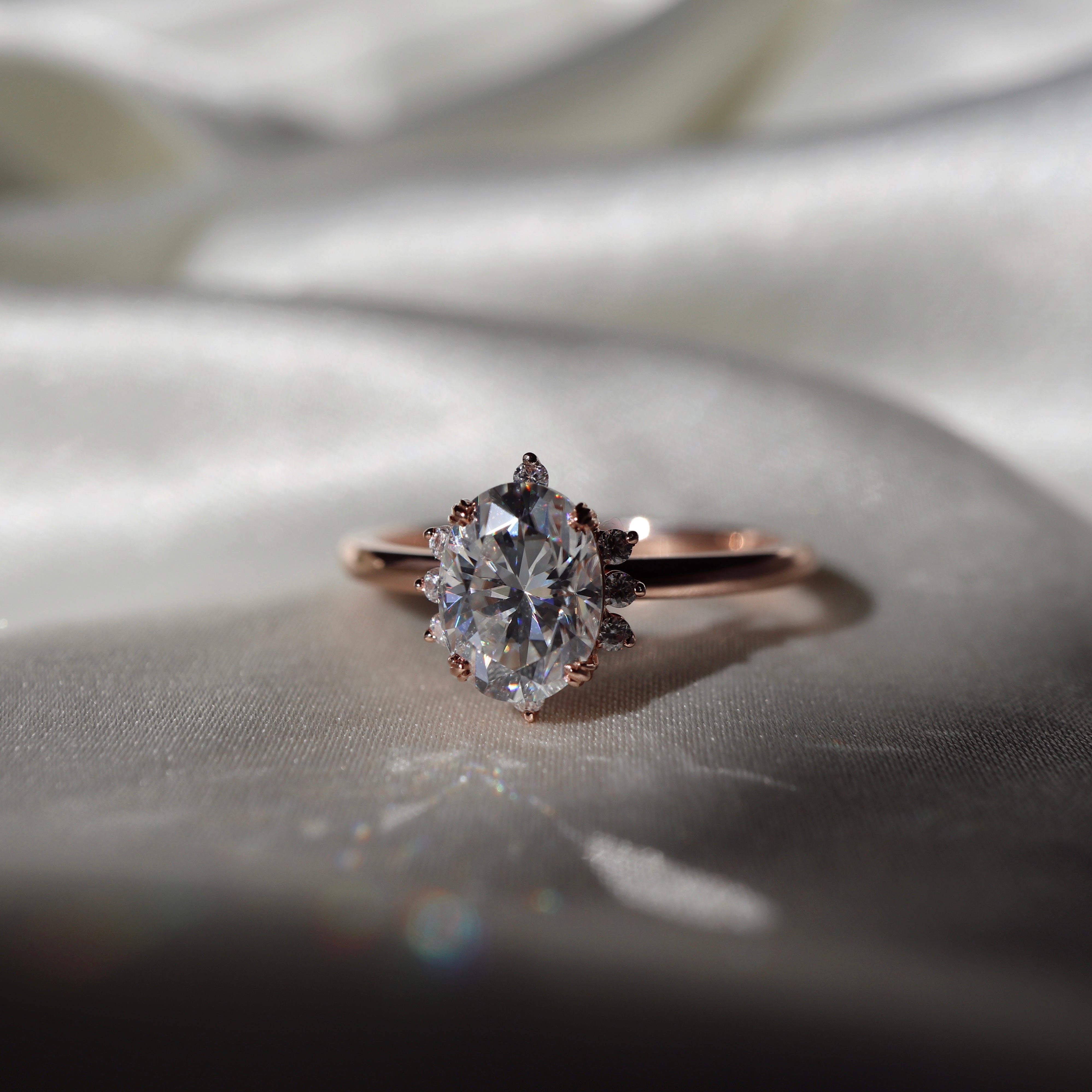 The Carmen Ring - Oval With Dainty Halo Stones