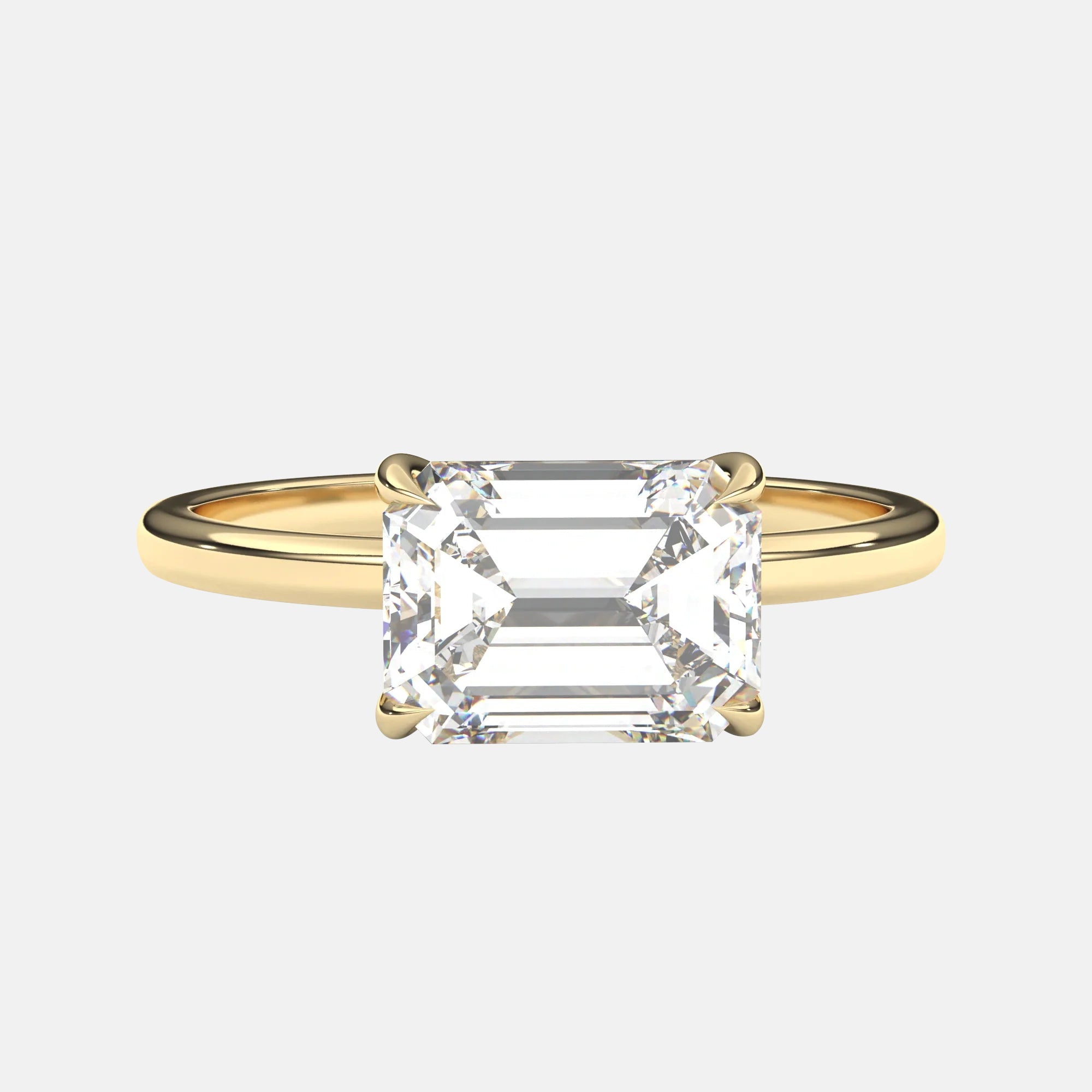 The Cora Ring - Horizontal Emerald Solitaire