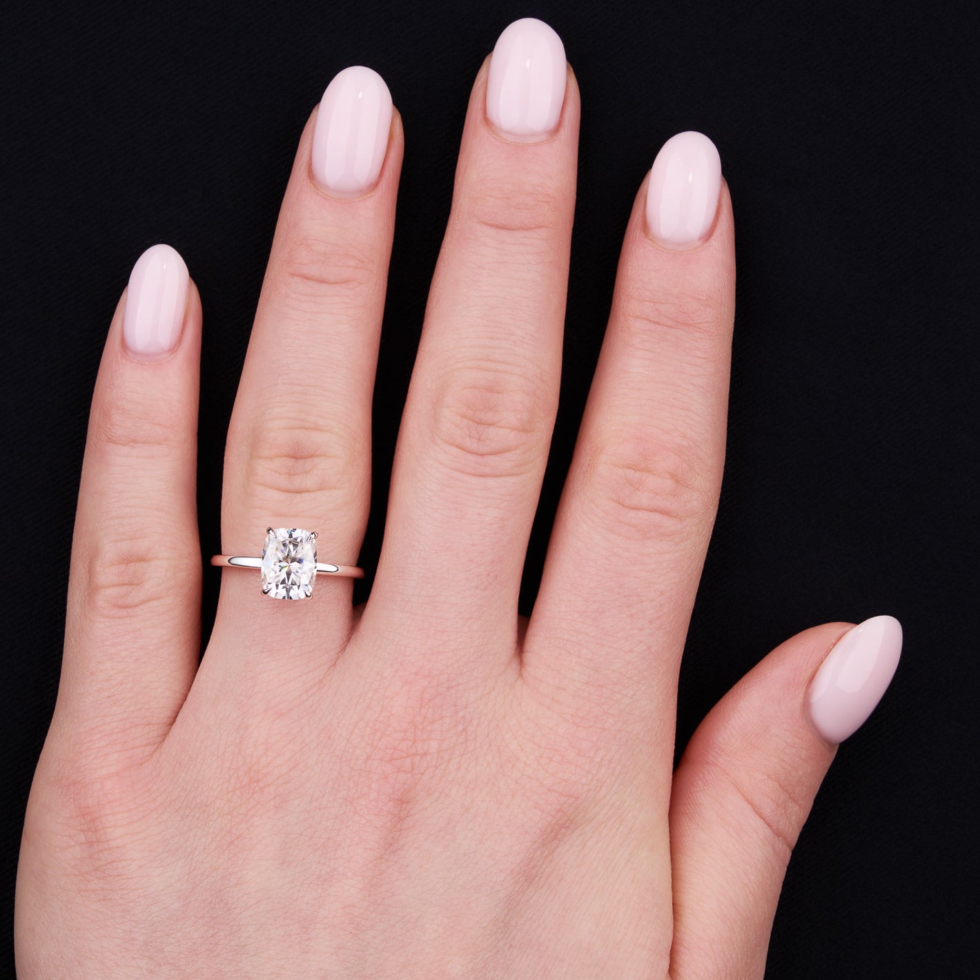 Elongated cushion clearance cut solitaire