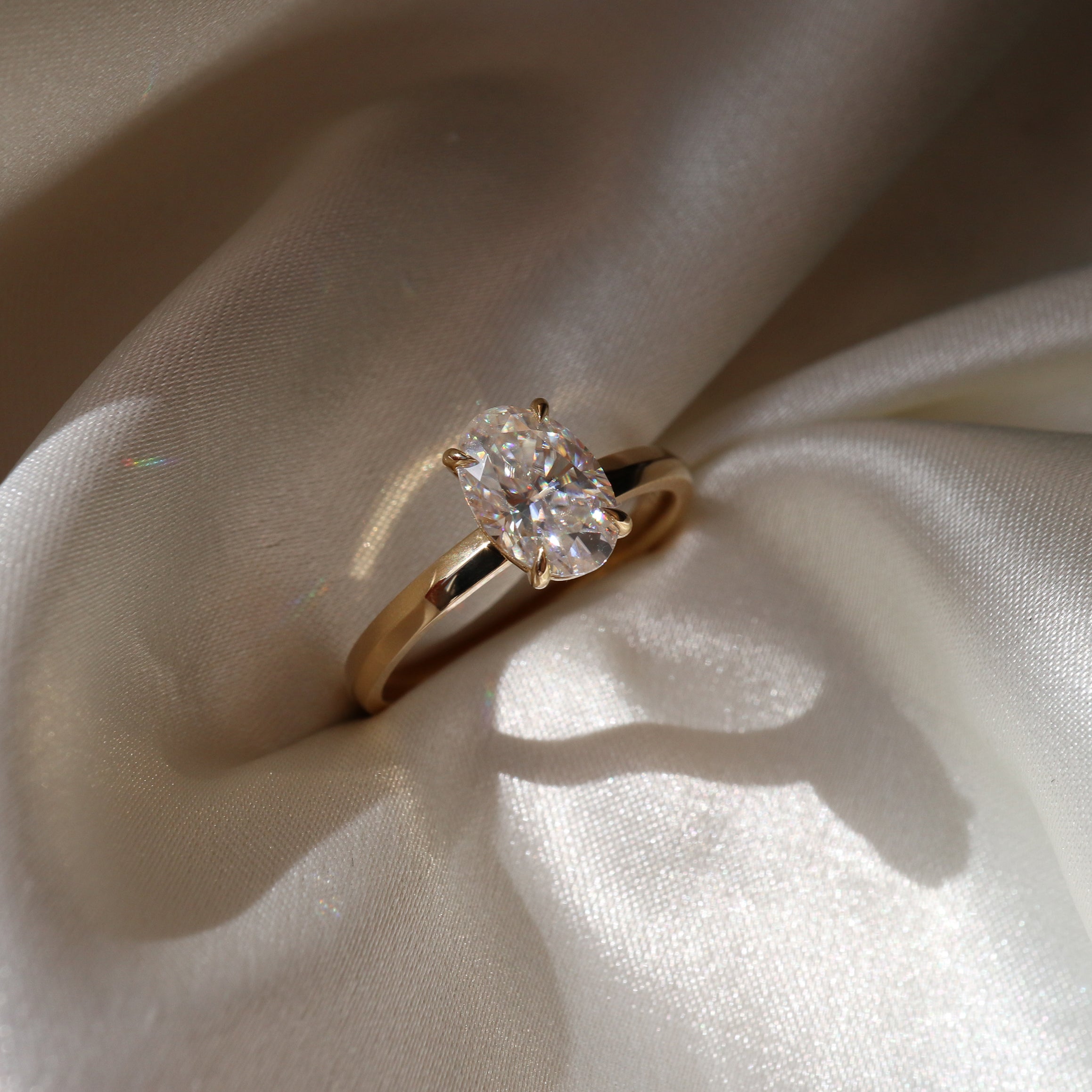 The Luise Ring™ - Oval Solitaire With Knife Edge Band